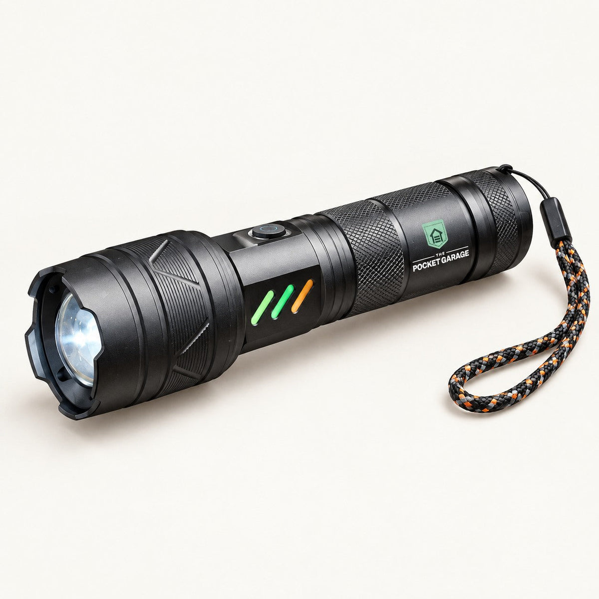 PocketBeam Telescopic LED Flashlight with The Pocket Garage branding on a warm off-white background.